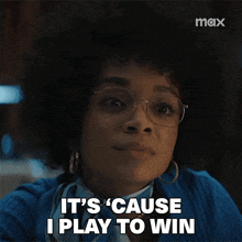 a woman wearing glasses is saying it 's cause i play to win
