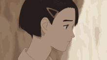 a close up of a girl with a triangle in her hair
