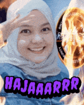 a woman wearing a hijab is smiling with a coin in the background that says ' bintang ' on it