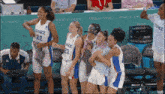 a group of female basketball players from france are standing together