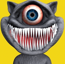 a cartoon cat with a big eye and sharp teeth is smiling .