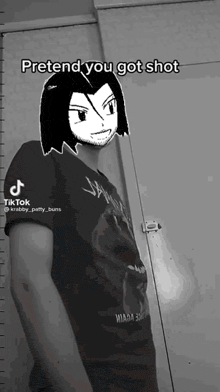 a man is standing in front of a wall with a cartoon character on his head and the words pretend you got shot