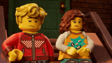 a boy and a girl are sitting on a set of stairs