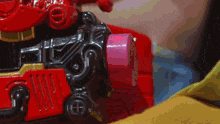a close up of a toy train with the letter h on the front of it