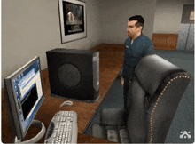 a man stands in front of a dell computer in a room