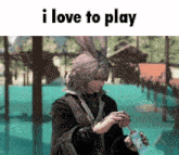 a man with bunny ears is drinking from a cup with the words i love to play above him .