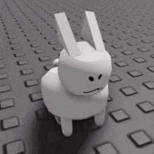 a white bunny with a sad face is walking on a gray surface .