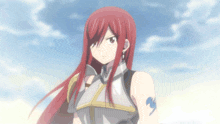 a girl with long red hair is wearing a knight 's armor