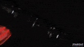 a shotout video editor shows a red object on a dark background