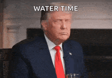 donald trump is wearing a suit and tie and holding a glass of water with the words water time above him