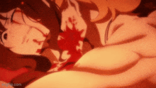 a close up of a person laying down with blood on their chest .