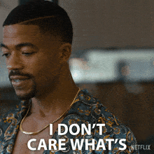 a man with a necklace says i don t care what 's