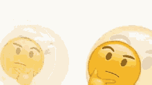 a couple of smiley faces with their hands on their chins on a white background .
