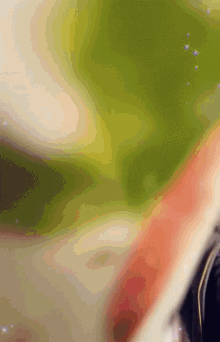 a blurred image of a green and white background