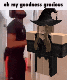 a girl in a witch costume is standing next to a man in a black shirt who says " oh my goodness gracious "