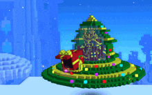 a christmas tree made out of blocks with a gift box in it