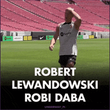 a soccer player named robert lewandowski is on a field