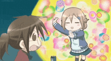 a girl in a blue jacket is standing next to another girl in a blue jacket .