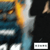 a blurry picture of a person with the word ujang on the bottom right