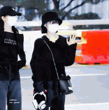a woman wearing a black sweater that says culpton tasterpie on it