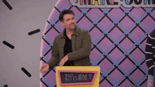 a man stands behind a podium that says josh on it
