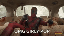 deadpool is sitting in the back seat of a car holding a knife and says `` omg girly pop '' .