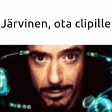 a close up of a man 's face with the words `` jarvinen , ota clipille '' written above him .