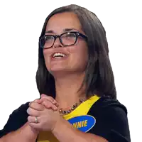 a woman wearing glasses and a yellow shirt with the name annie on it