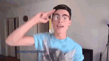 a young man wearing glasses and a blue shirt says welovelawley on the bottom