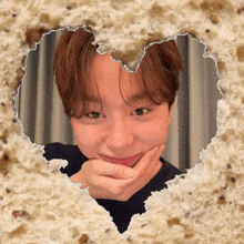 a picture of a young man with a heart shaped hole in it