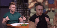 a man in a green shirt and a man in a black shirt are giving thumbs up