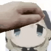 a person is putting their hand on a cartoon character 's face .