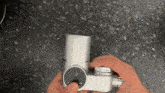 a person is holding a device that has a button that says ' off '