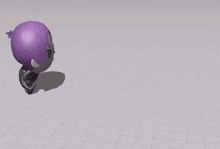 a purple and a black object are laying on a grid surface