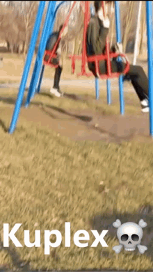 a person sitting on a swing with the word kuplex on the bottom of the image