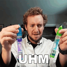 a man in a lab coat is holding a purple and green liquid in his hands and the word uhm is on the bottom right