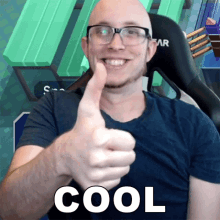 a bald man wearing glasses gives a thumbs up with the word cool written below him