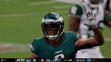 a player for the eagles is waving his hand