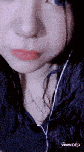 a close up of a woman 's face with the words vivavideo below