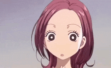 a close up of a girl 's face with pink hair and big eyes