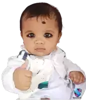 a baby with a black spot on his forehead is giving a thumbs up sign