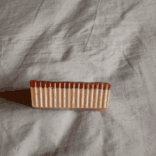 a piece of chocolate with a brown stripe on the side