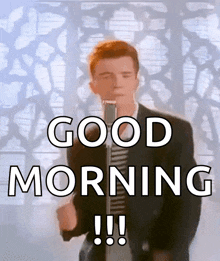a man singing into a microphone with the words " good morning " below him