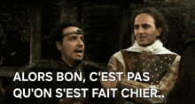 two men are standing next to each other with the words " alors bon c'est pas qu'on s'est fait chier "