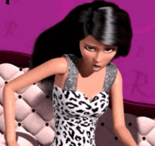 a barbie doll is sitting on a couch with a leopard print dress on