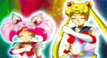 a sailor moon and a sailor chibi moon are standing next to each other with their eyes closed