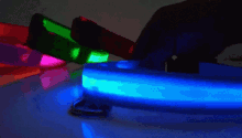 a person is holding a glow in the dark item in their hand