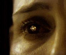 a close up of a woman 's eye with a reflection