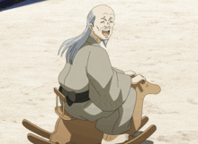 a man with long hair is sitting on a rocking horse