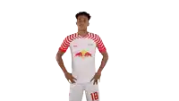 a soccer player wearing a white jersey with red bulls and the number 18 on the shorts